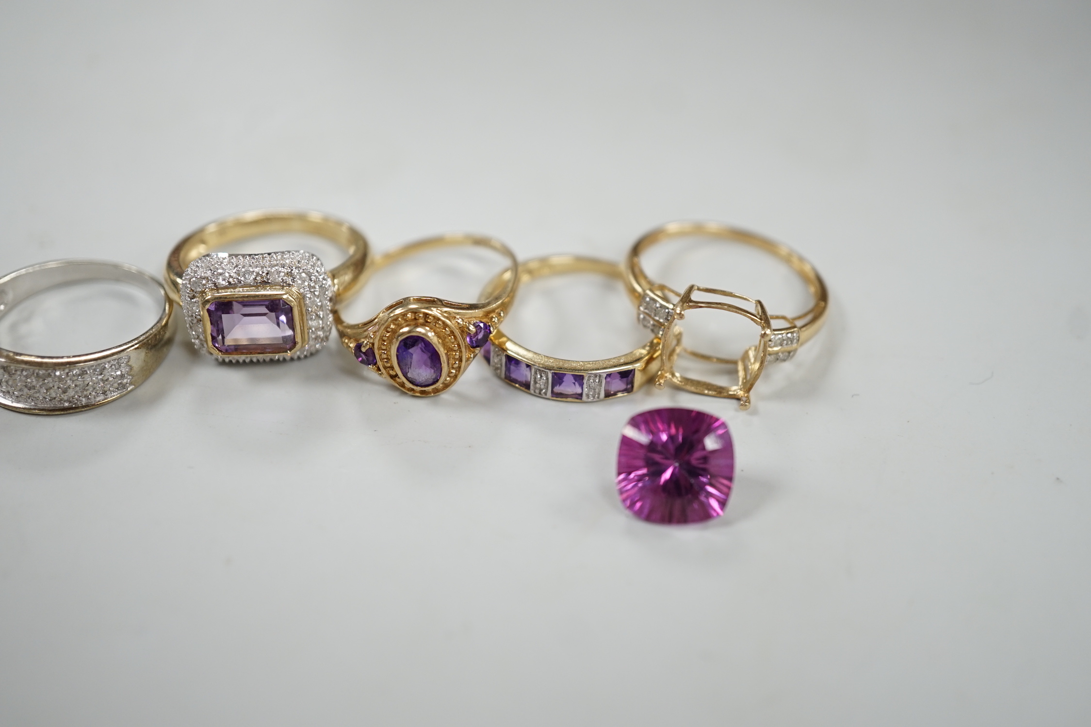 Five assorted modern 9ct gold and gem set dress rings, including diamond chip half hoop and amethyst and diamond chip half hoop, gross weight 12.6 grams.